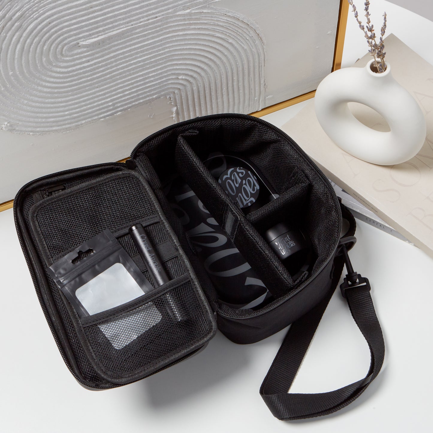 Open Coast Angels Hackney Kit bag in a lifestyle setting, displaying all components neatly arranged inside for convenient and discreet storage.