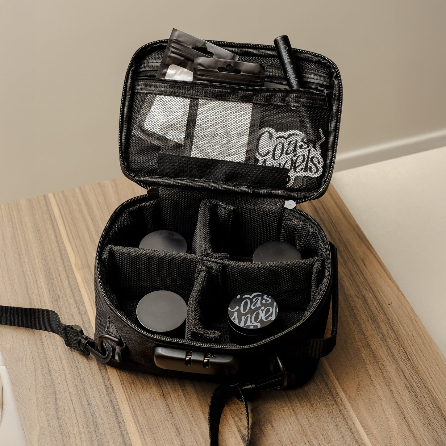 Black Coast Angels smell proof bag on a wooden surface