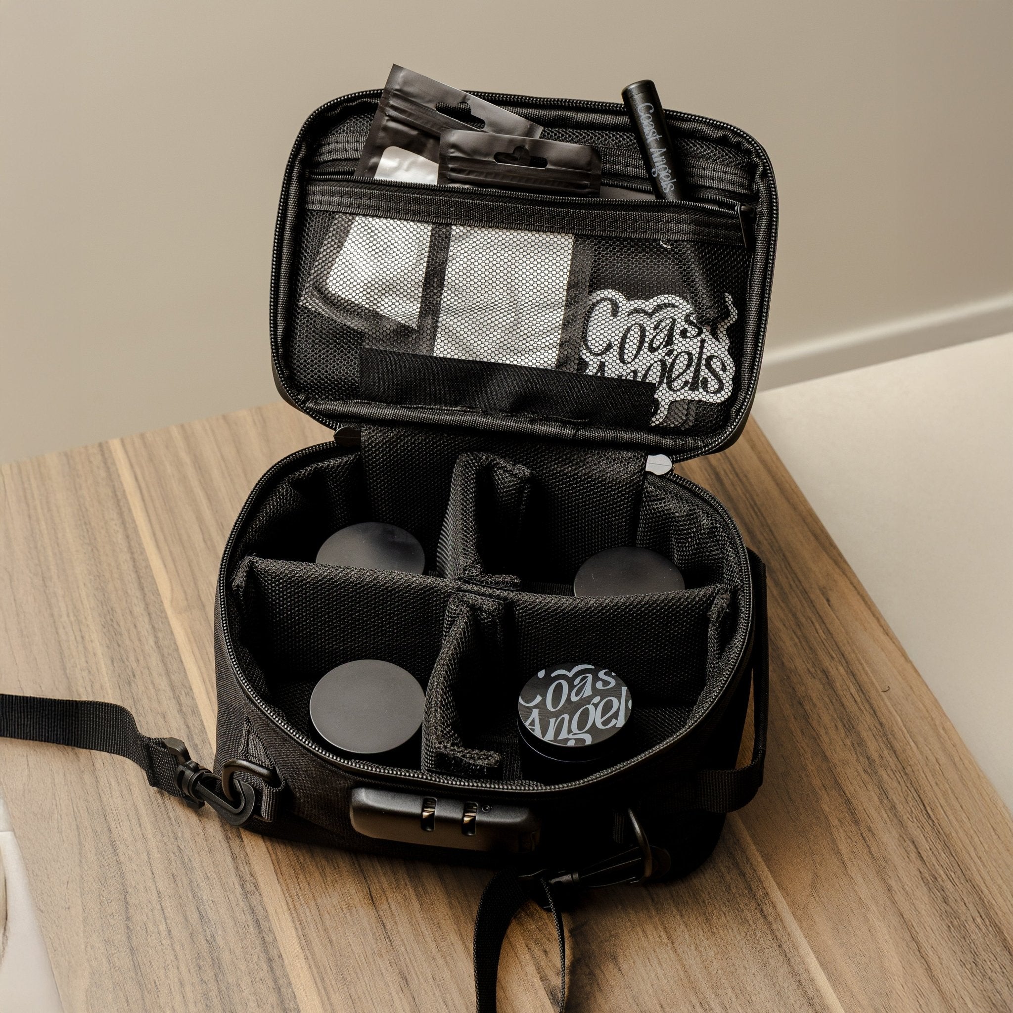 Black Coast Angels smell proof bag on a wooden surface